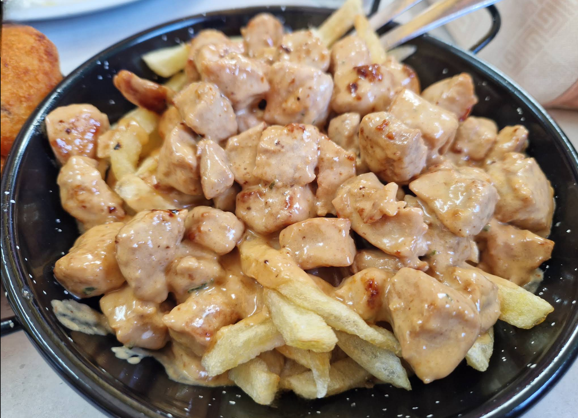 Raxo a la pimienta con patatas
